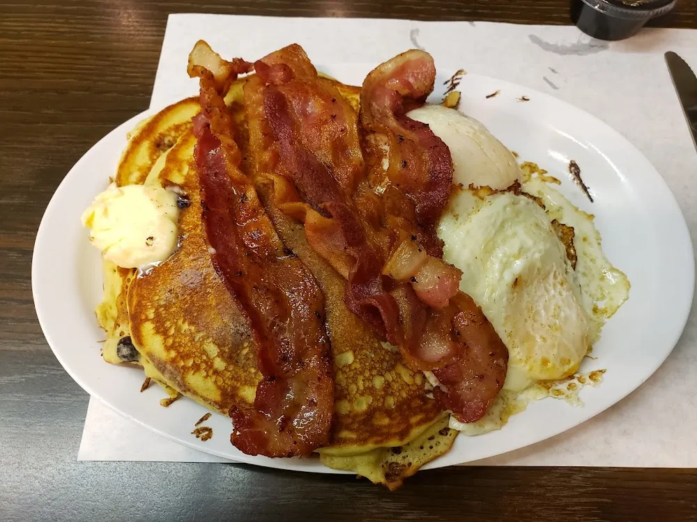 Blueberry Pancakes Bacon and 2 Eggs over Medium